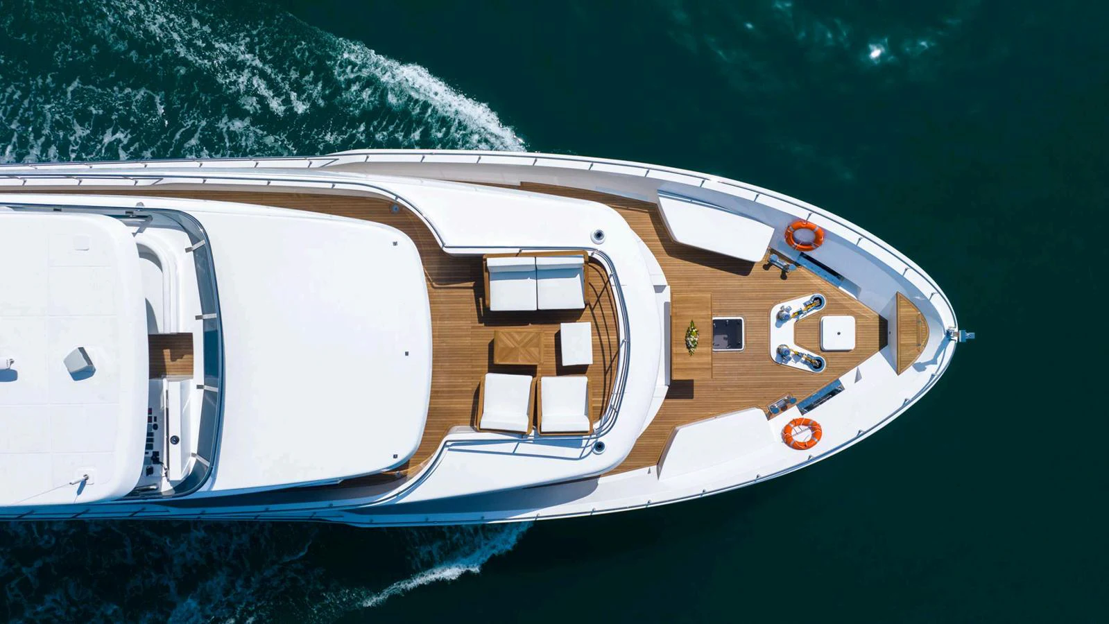 The yacht's foredeck features elegant sun loungers and a spacious seating area, perfect for relaxation. aboard NOMAD 101 ON-ORDER Yacht for Sale