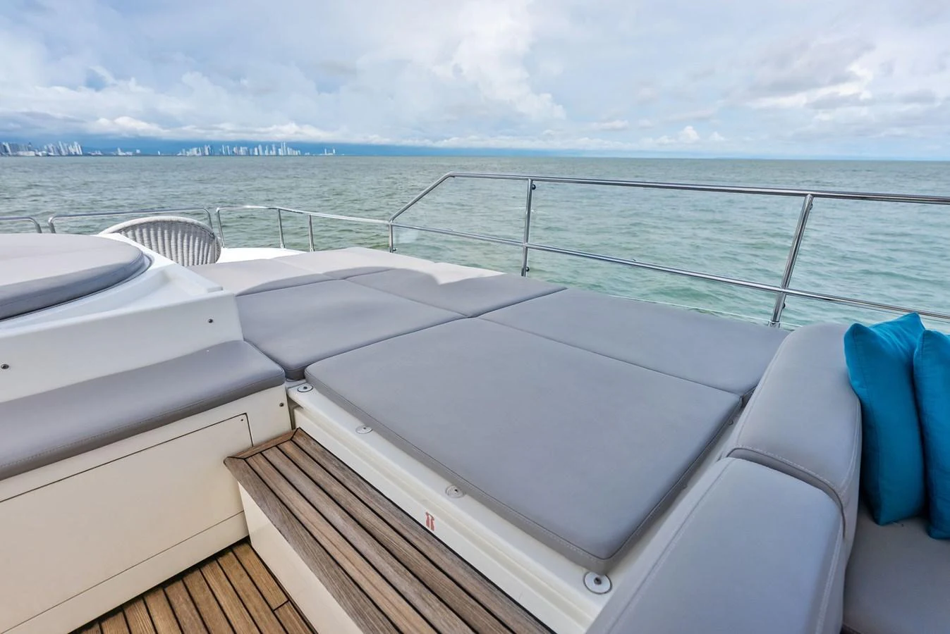 The sundeck offers a spacious lounging area with comfortable cushions and a stunning ocean view. aboard SHA SHA SHA IV Yacht for Sale
