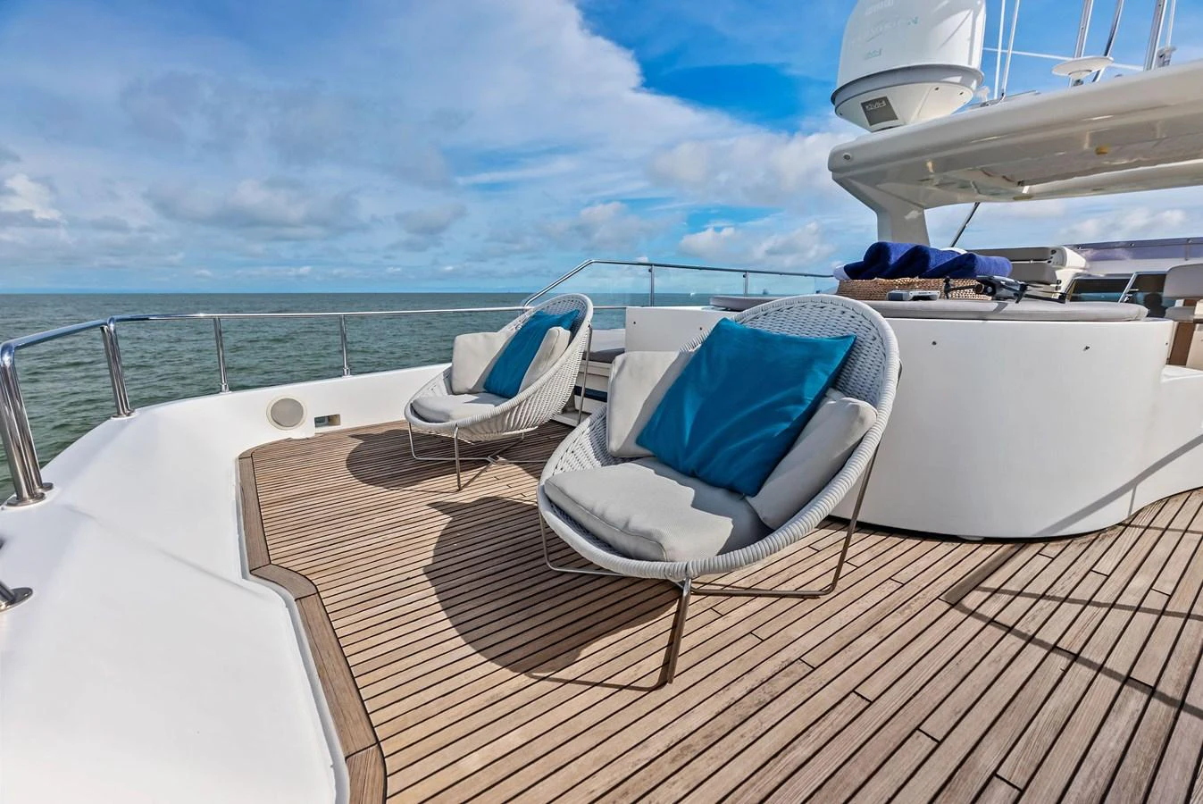 The flybridge offers a relaxing outdoor space with stylish seating and stunning ocean views. aboard SHA SHA SHA IV Yacht for Sale