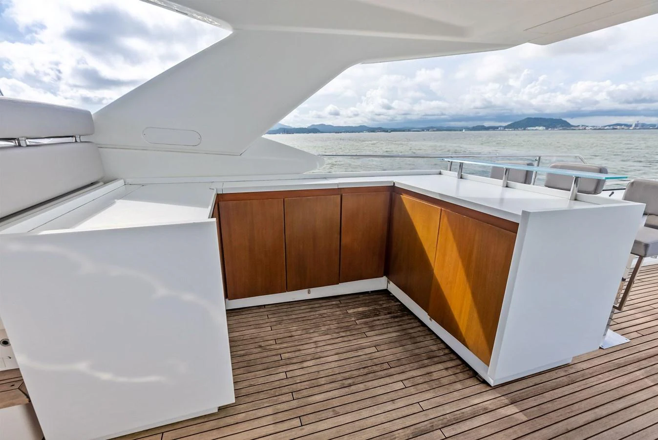 A sleek outdoor bar area on the yacht offers a perfect spot for refreshments with a scenic view. aboard SHA SHA SHA IV Yacht for Sale