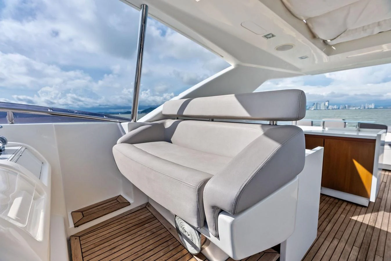 The flybridge offers a comfortable seating area with stunning views of the surrounding waters. aboard SHA SHA SHA IV Yacht for Sale