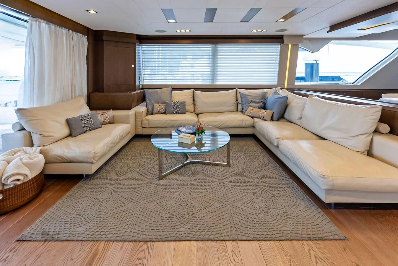 The salon features a spacious and elegant seating area with plush sofas and a stylish coffee table. aboard SHA SHA SHA IV Yacht for Sale