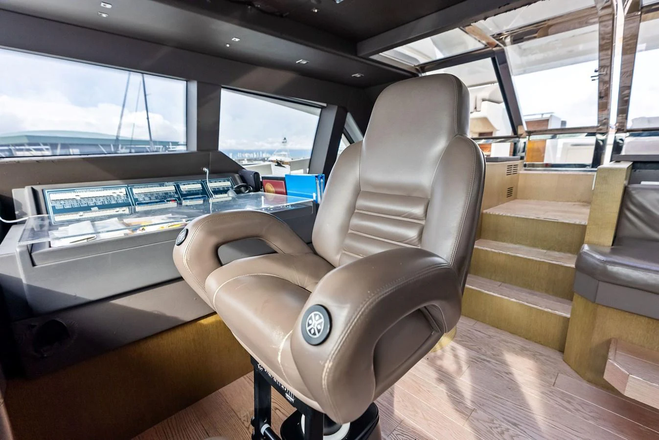 The helm features a luxurious captain's chair and state-of-the-art navigation equipment. aboard SHA SHA SHA IV Yacht for Sale