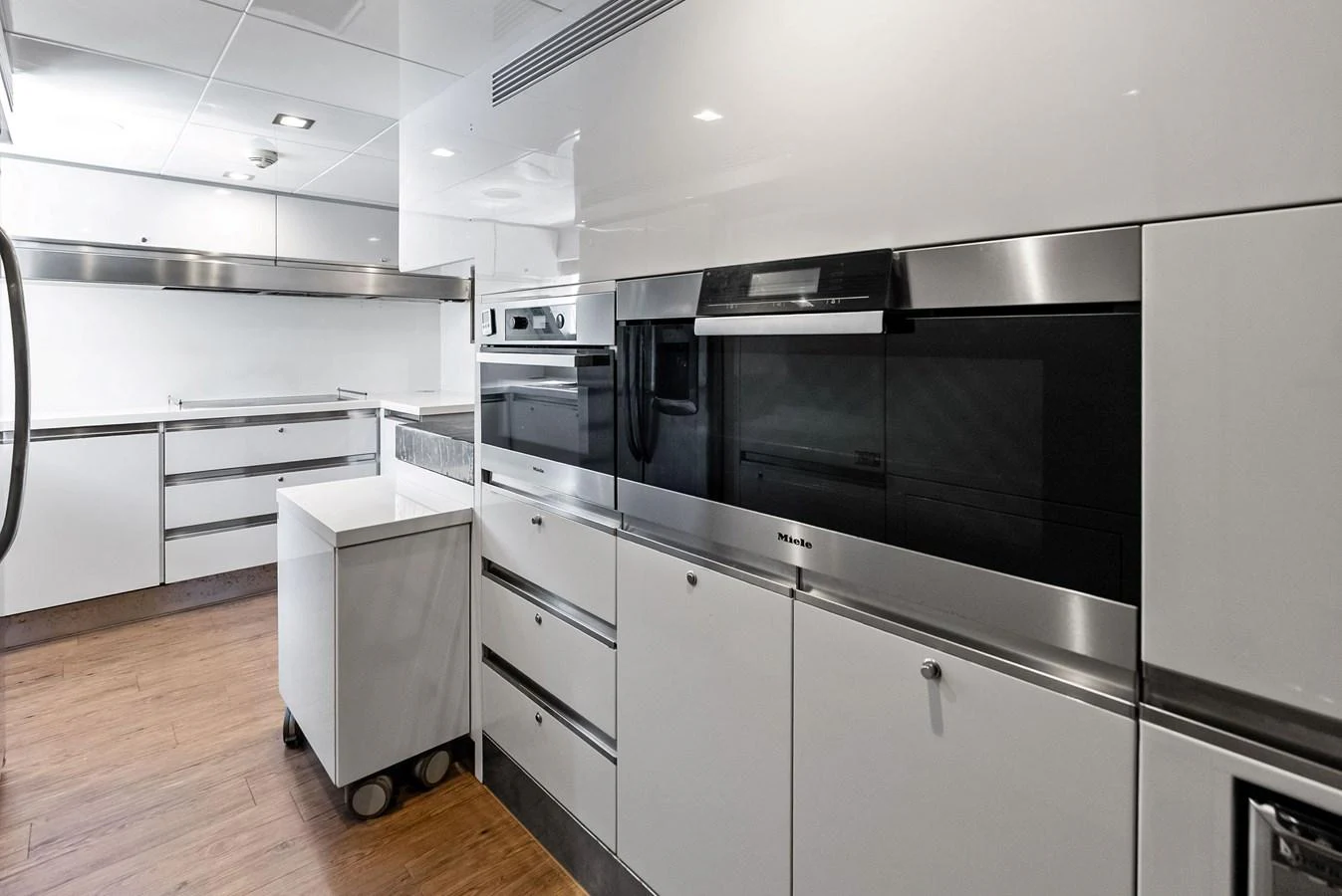 The sleek and modern galley is equipped with high-end appliances and ample storage space. aboard SHA SHA SHA IV Yacht for Sale