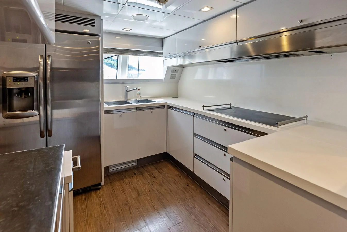 The galley features modern appliances and sleek cabinetry, providing a functional and stylish cooking space. aboard SHA SHA SHA IV Yacht for Sale