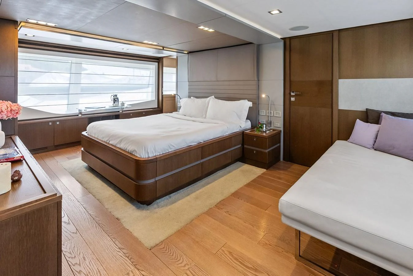 The master stateroom offers a spacious and elegant retreat with modern furnishings and ample natural light. aboard SHA SHA SHA IV Yacht for Sale
