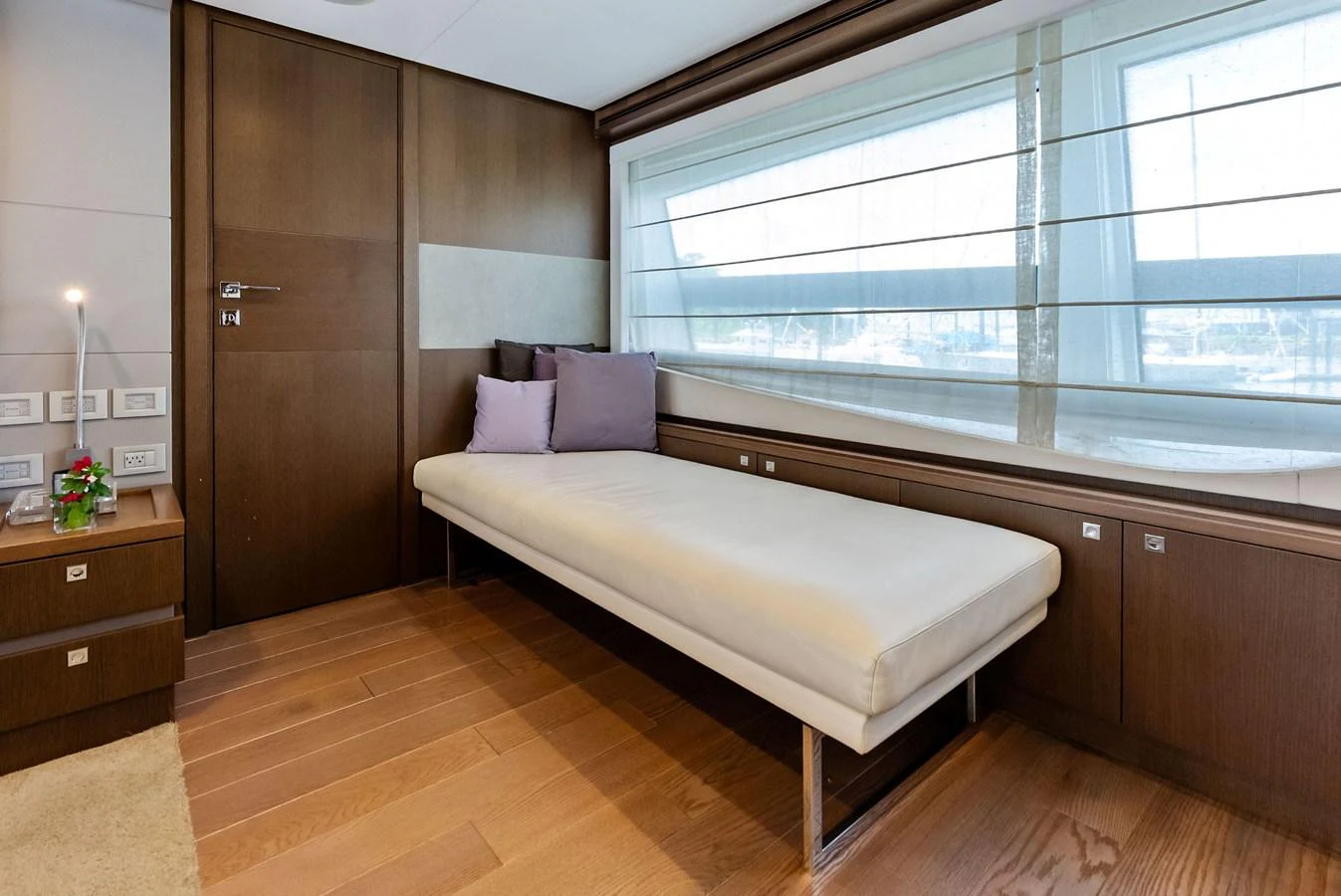 The yacht's interior features a cozy seating area with a modern design and ample natural light. aboard SHA SHA SHA IV Yacht for Sale