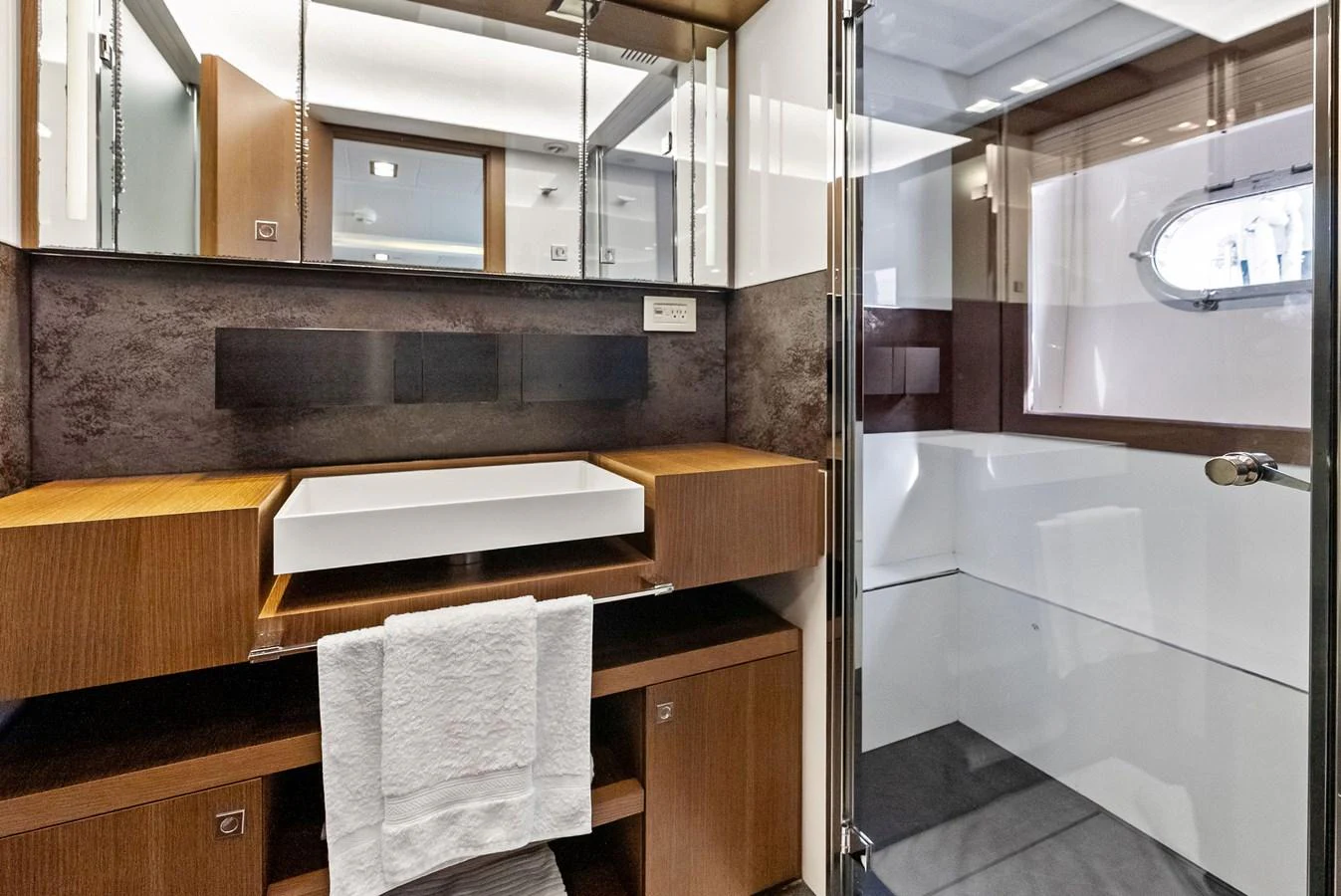 The yacht's bathroom features modern fixtures and a sleek design. aboard SHA SHA SHA IV Yacht for Sale