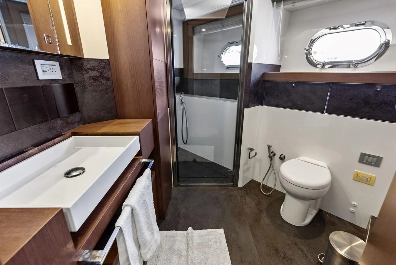 The yacht's bathroom features modern fixtures and a sleek design. aboard SHA SHA SHA IV Yacht for Sale