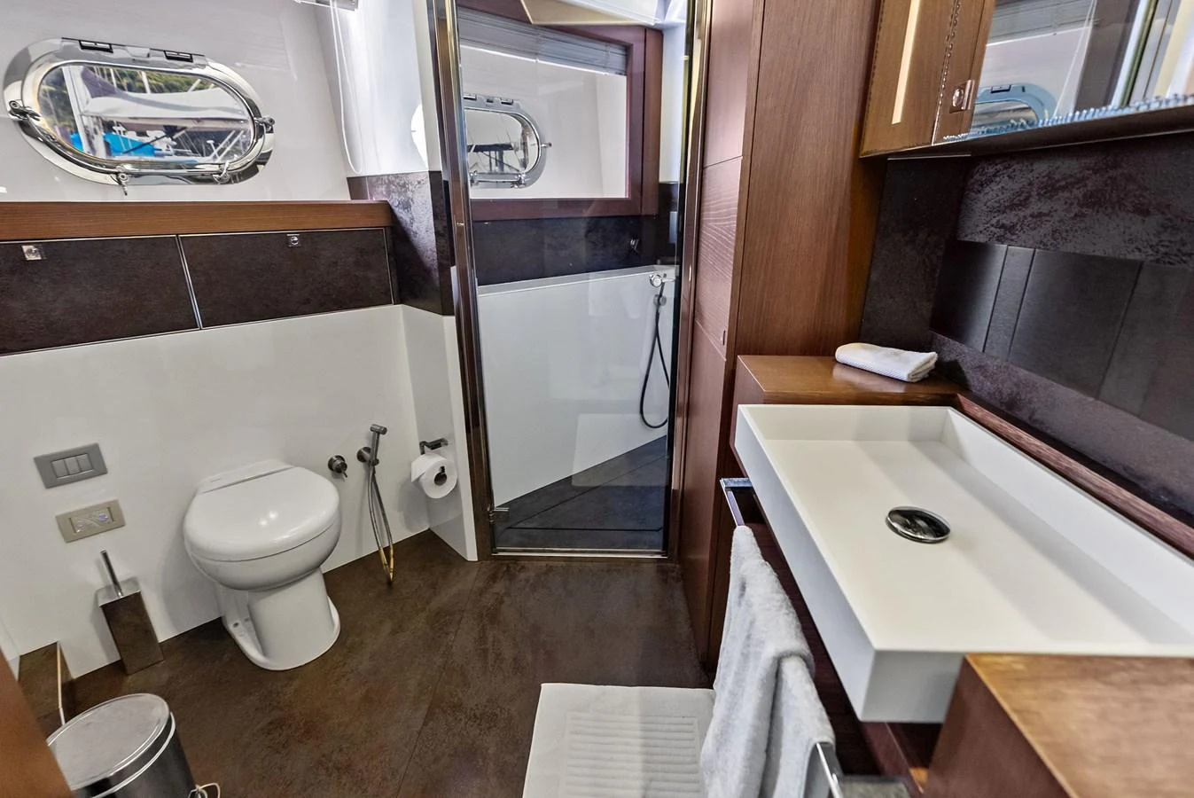 The yacht's bathroom features modern fixtures and a sleek design. aboard SHA SHA SHA IV Yacht for Sale