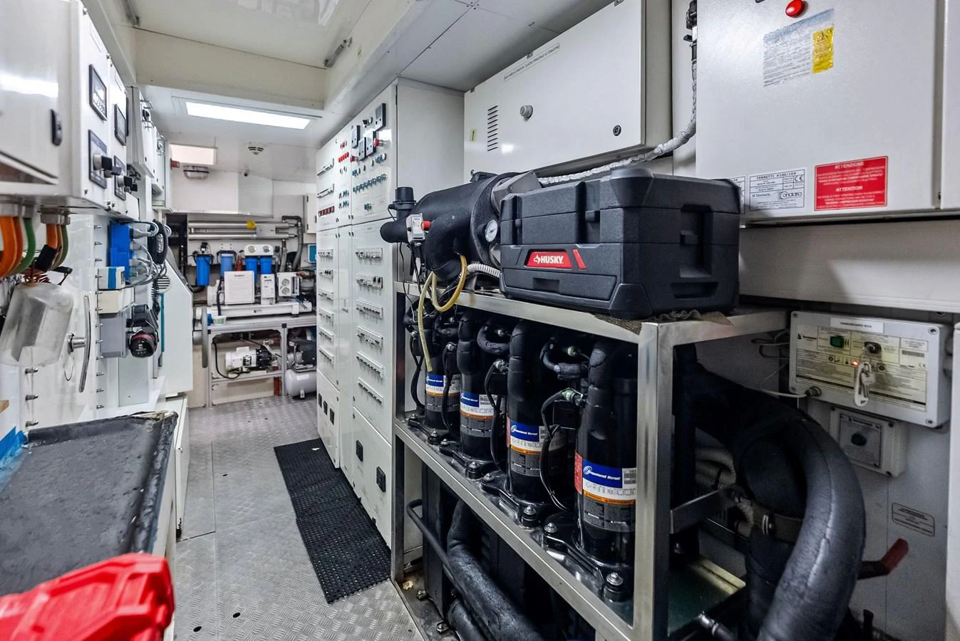 The image showcases the yacht's well-maintained engine room with advanced machinery and equipment. aboard SHA SHA SHA IV Yacht for Sale