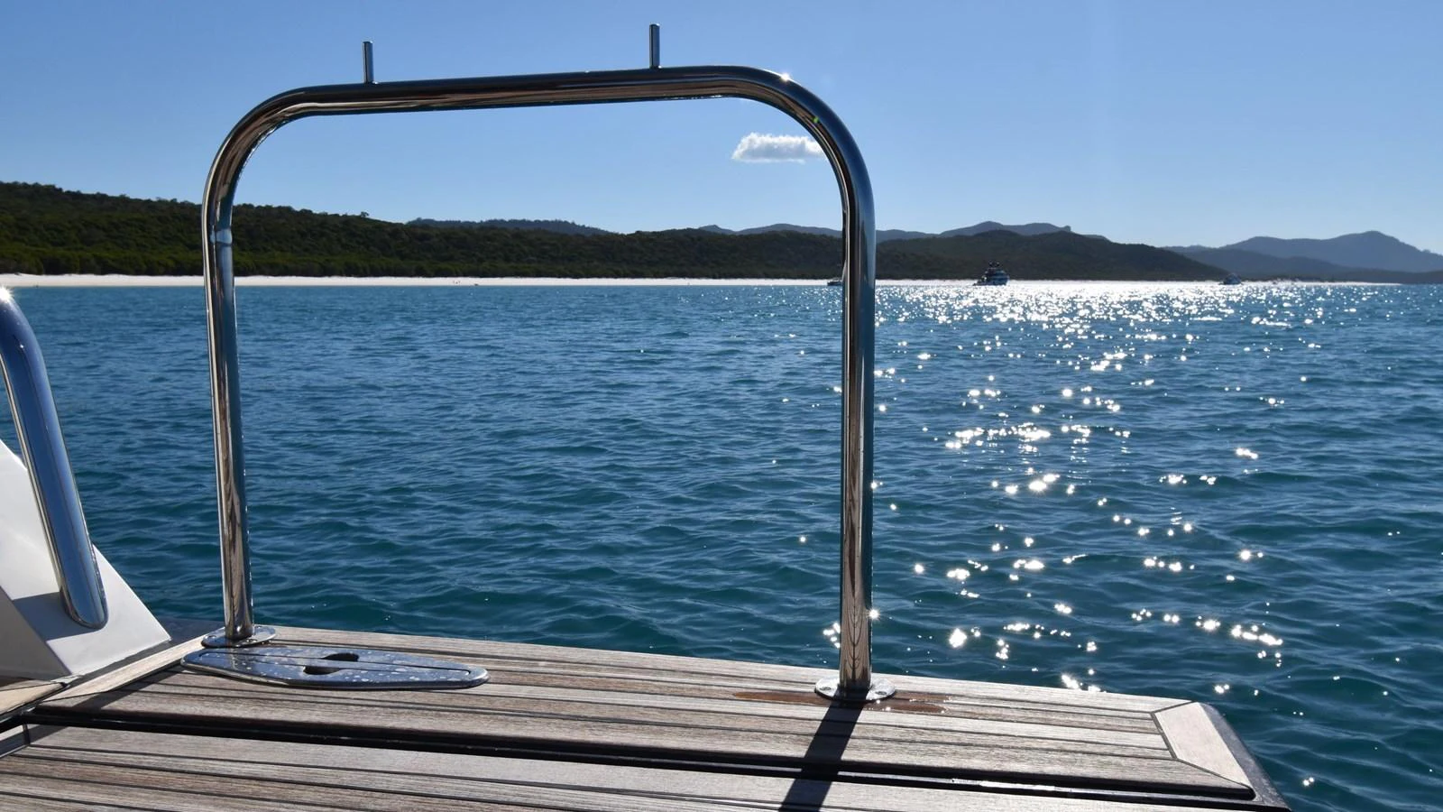 The yacht's swim platform offers a serene spot to enjoy the sparkling waters. aboard LA MAR Yacht for Sale