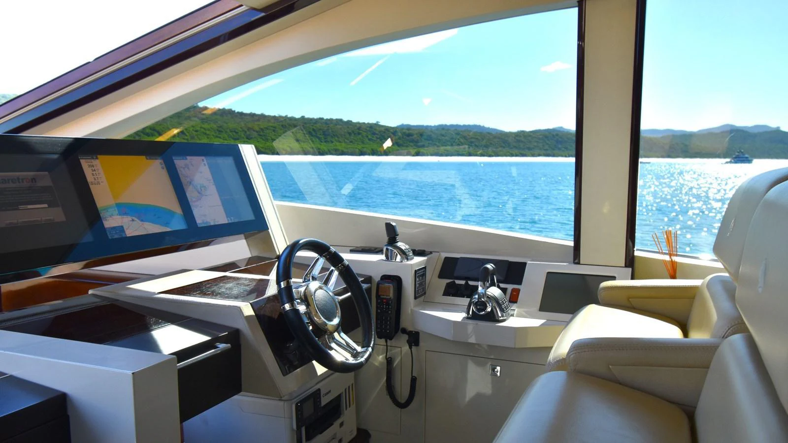 The helm station offers a panoramic view of the surrounding waters and landscape. aboard LA MAR Yacht for Sale