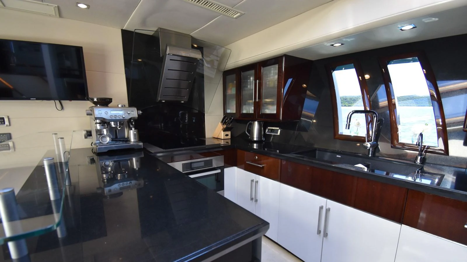 The yacht's galley is equipped with modern appliances and sleek finishes, offering a stylish and functional space for culinary activities. aboard LA MAR Yacht for Sale