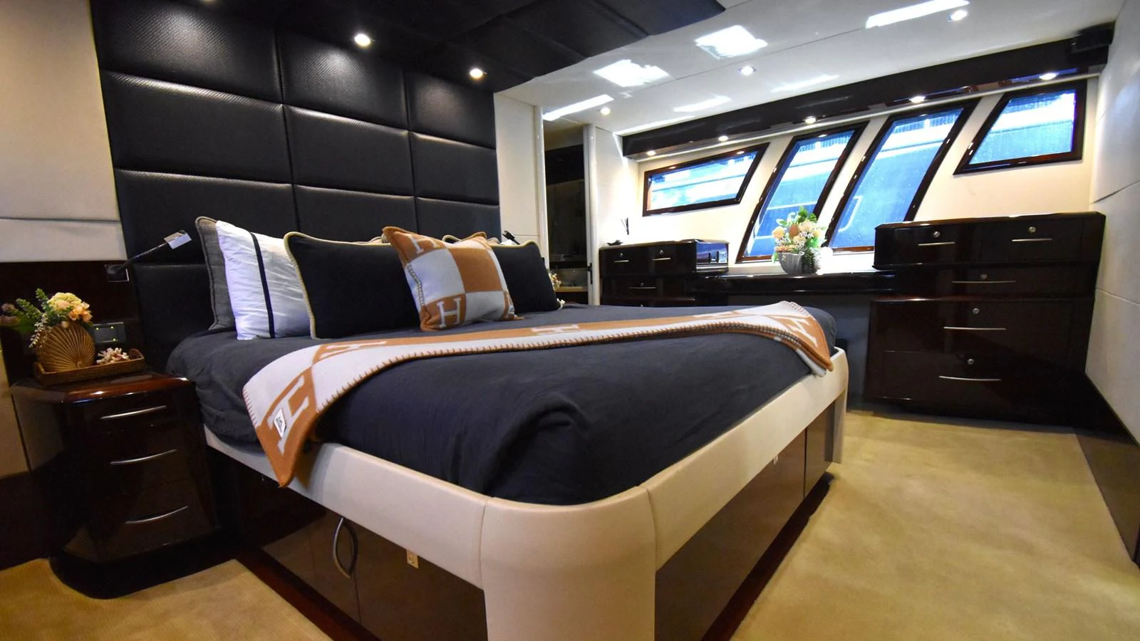 The master stateroom offers a luxurious and spacious retreat with elegant furnishings and ample natural light. aboard LA MAR Yacht for Sale