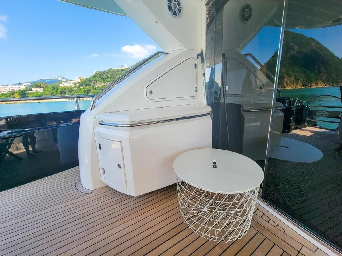 a white washing machine on a deck aboard 2008 SUNSEEKER 90  @ ACAPULCO Yacht for Sale