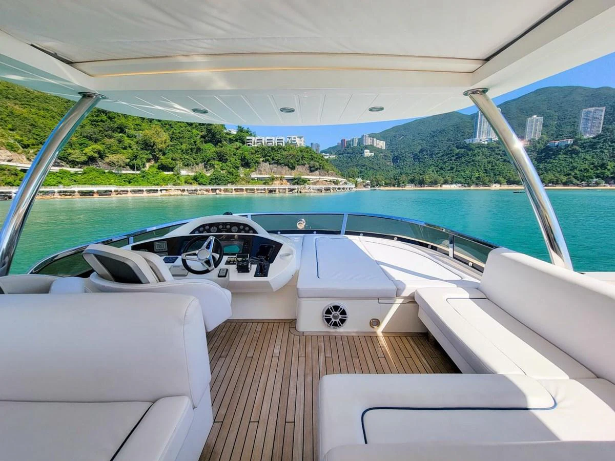 a deck with a view of a lake and a boat on it aboard 2008 SUNSEEKER 90  @ ACAPULCO Yacht for Sale