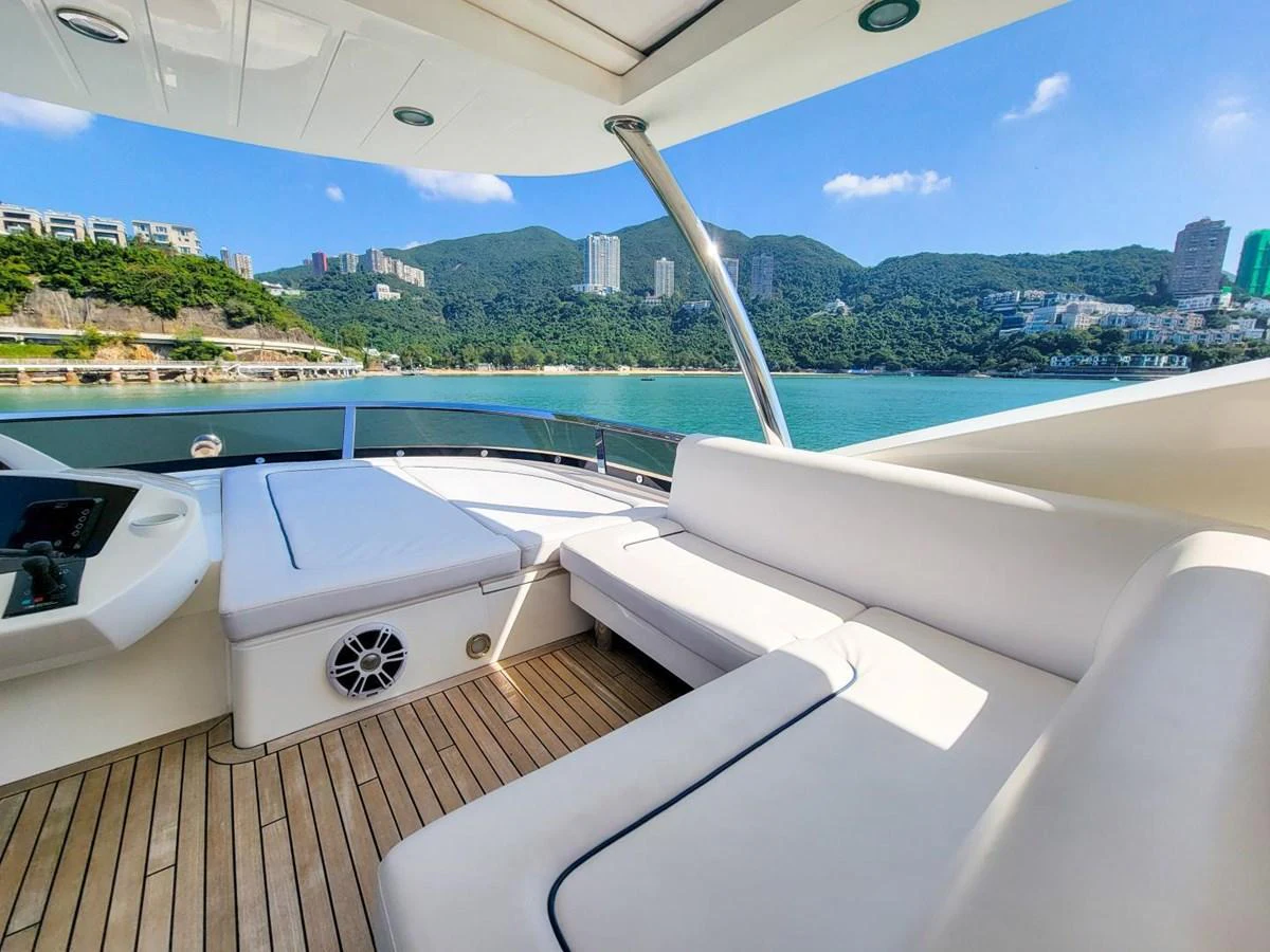 a room with a view of a city and a body of water aboard 2008 SUNSEEKER 90  @ ACAPULCO Yacht for Sale