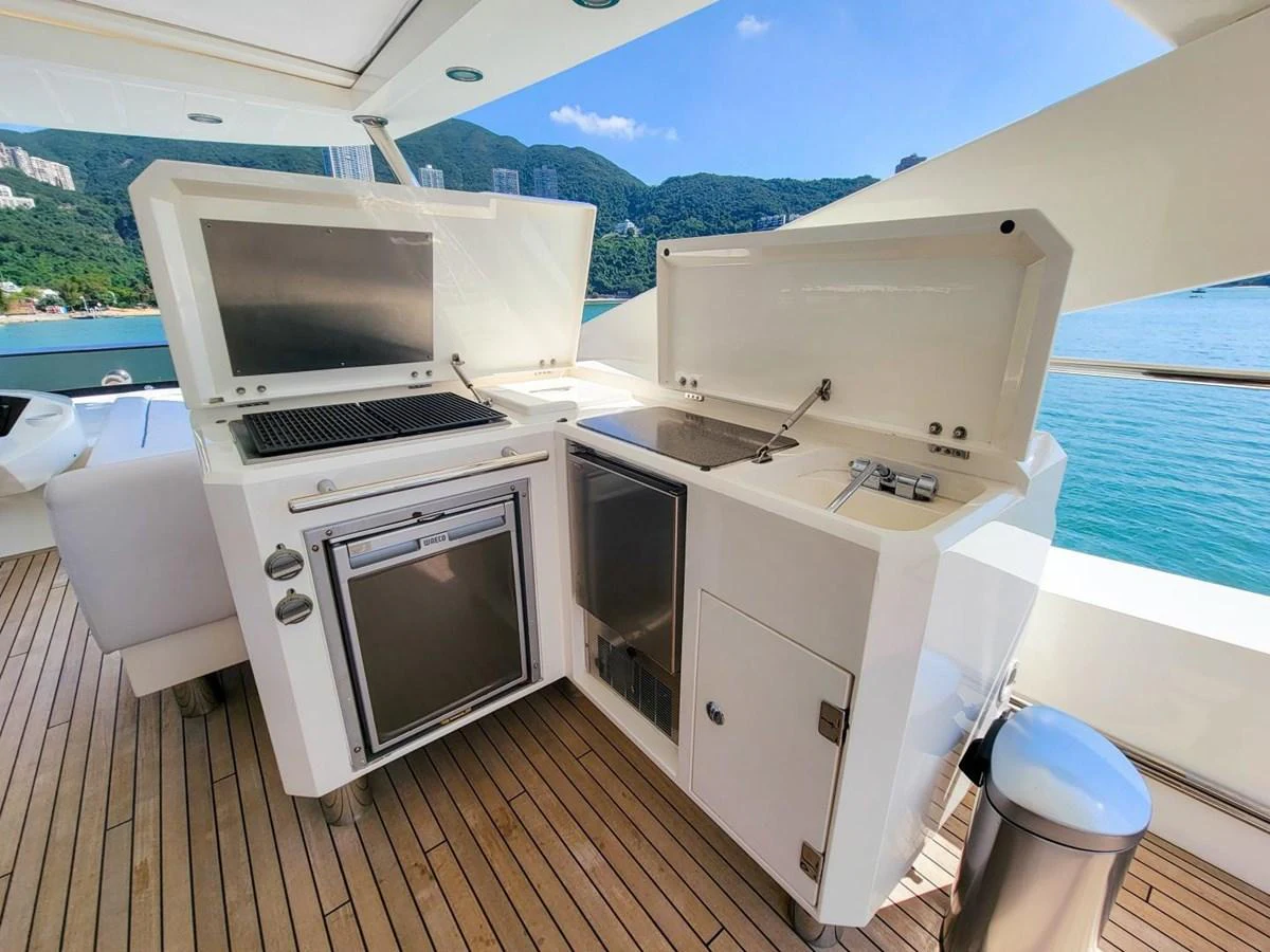 a boat with a microwave and a sink on it aboard 2008 SUNSEEKER 90  @ ACAPULCO Yacht for Sale