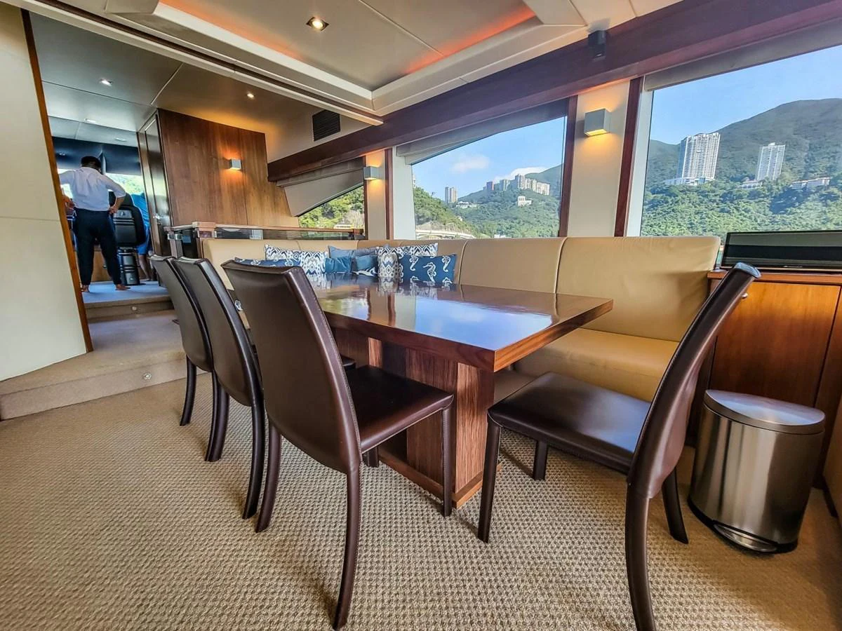a table and chairs in a room aboard 2008 SUNSEEKER 90  @ ACAPULCO Yacht for Sale
