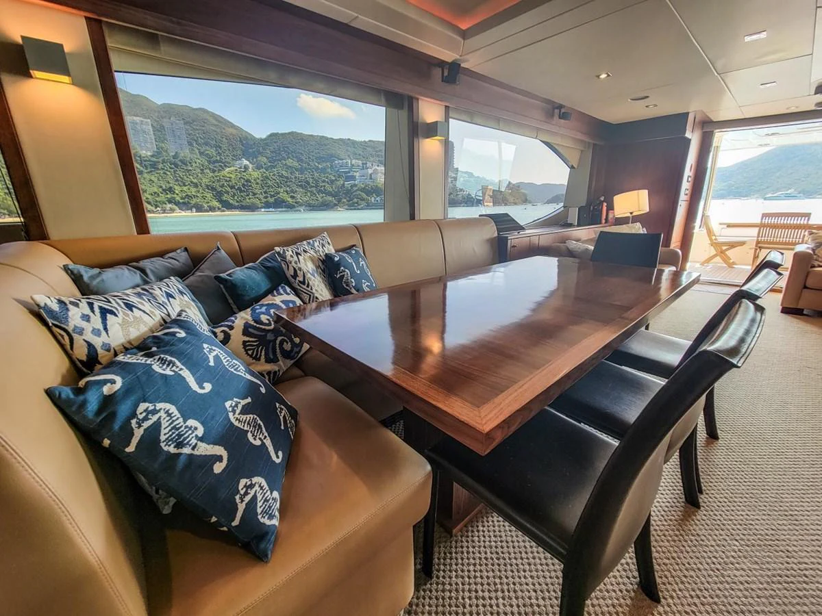 a living room with a couch and a table aboard 2008 SUNSEEKER 90  @ ACAPULCO Yacht for Sale