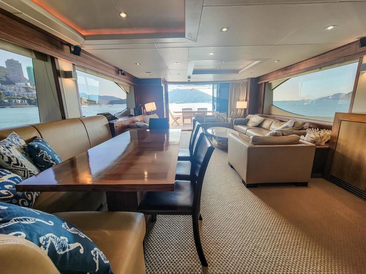a living room with a large window aboard 2008 SUNSEEKER 90  @ ACAPULCO Yacht for Sale