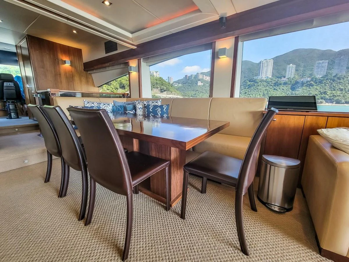 a table and chairs in a room aboard 2008 SUNSEEKER 90  @ ACAPULCO Yacht for Sale