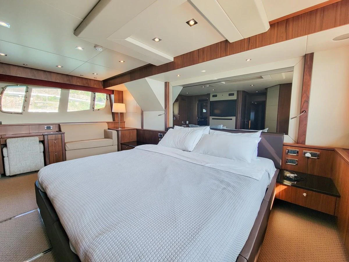 a large bed in a room aboard 2008 SUNSEEKER 90  @ ACAPULCO Yacht for Sale