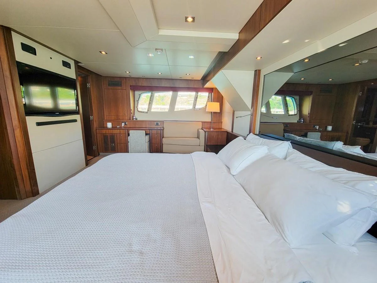a large bed in a room aboard 2008 SUNSEEKER 90  @ ACAPULCO Yacht for Sale
