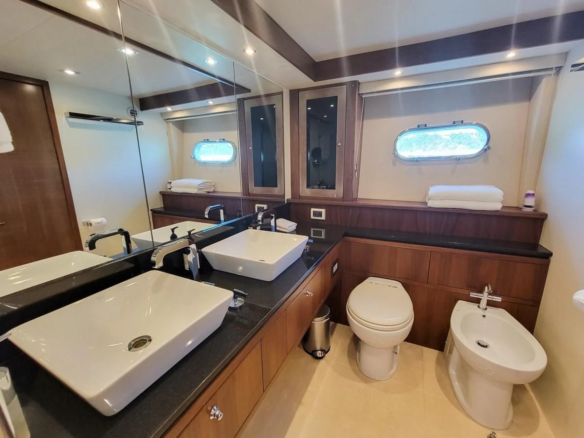 a bathroom with a large mirror aboard 2008 SUNSEEKER 90  @ ACAPULCO Yacht for Sale