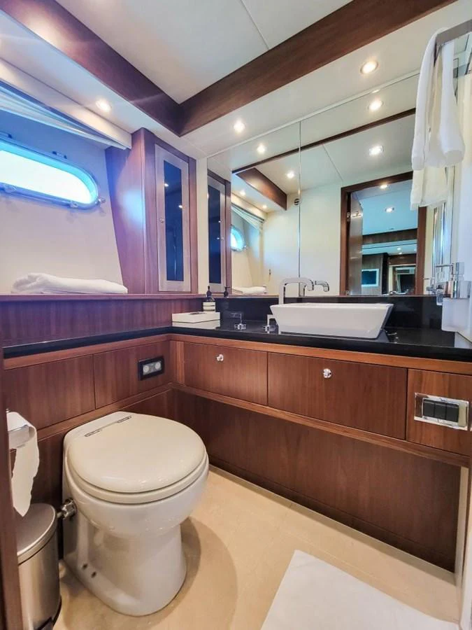 a bathroom with a toilet and a sink aboard 2008 SUNSEEKER 90  @ ACAPULCO Yacht for Sale