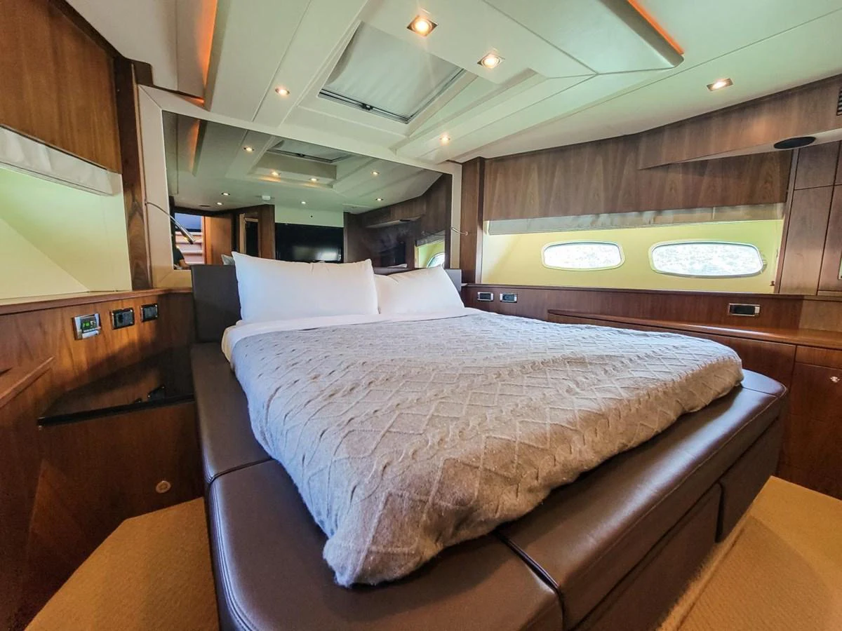 a bed in a room aboard 2008 SUNSEEKER 90  @ ACAPULCO Yacht for Sale