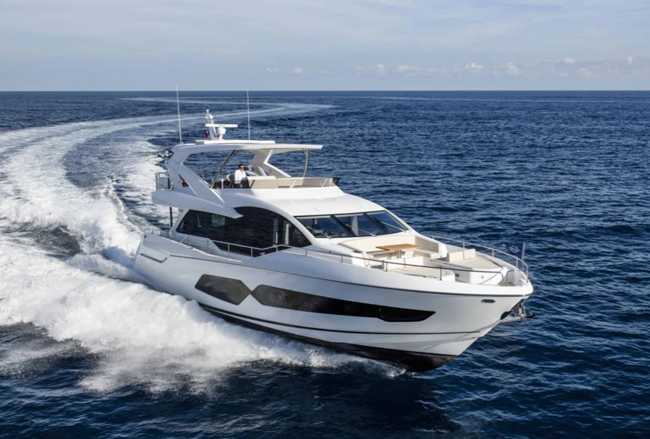 A sleek, modern yacht cruises swiftly through the open sea, showcasing its elegant design and powerful performance. aboard SVETLANA Yacht for Sale