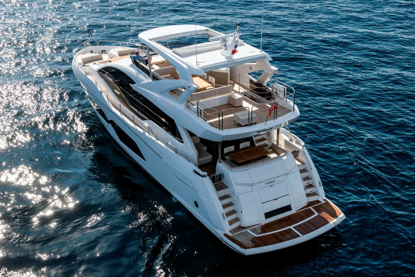 A sleek and modern yacht cruising on the open water, showcasing its spacious decks and elegant design. aboard SVETLANA Yacht for Sale