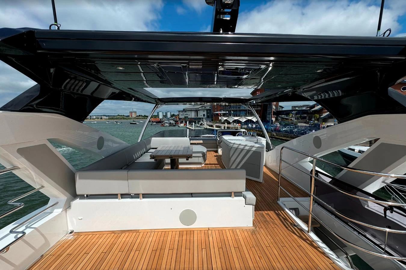 The aft deck features a spacious seating area with a sleek, modern design. aboard SVETLANA Yacht for Sale
