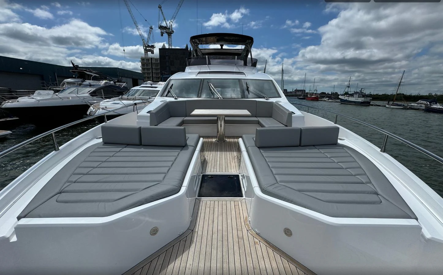 The foredeck features spacious sunpads and a comfortable seating area, perfect for relaxation. aboard SVETLANA Yacht for Sale