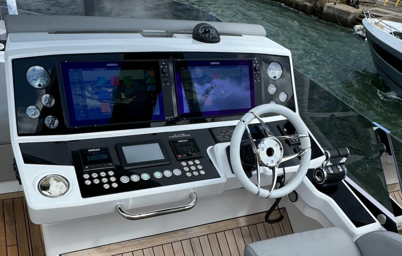 The helm station features advanced navigation equipment and a sleek steering wheel, offering a modern command center for the yacht. aboard SVETLANA Yacht for Sale