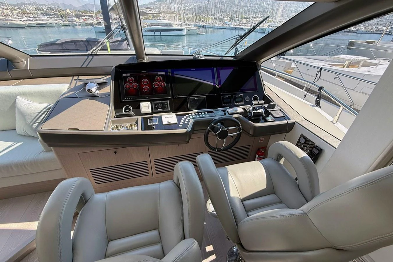 The helm station offers a sophisticated and modern control area with plush seating and advanced navigation equipment. aboard SVETLANA Yacht for Sale