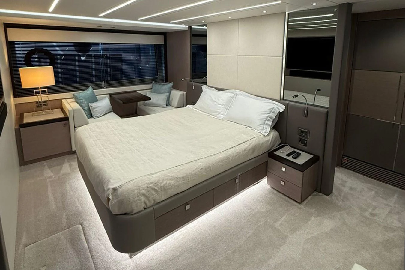 The master stateroom features a spacious bed, elegant lighting, and modern furnishings for ultimate comfort. aboard SVETLANA Yacht for Sale