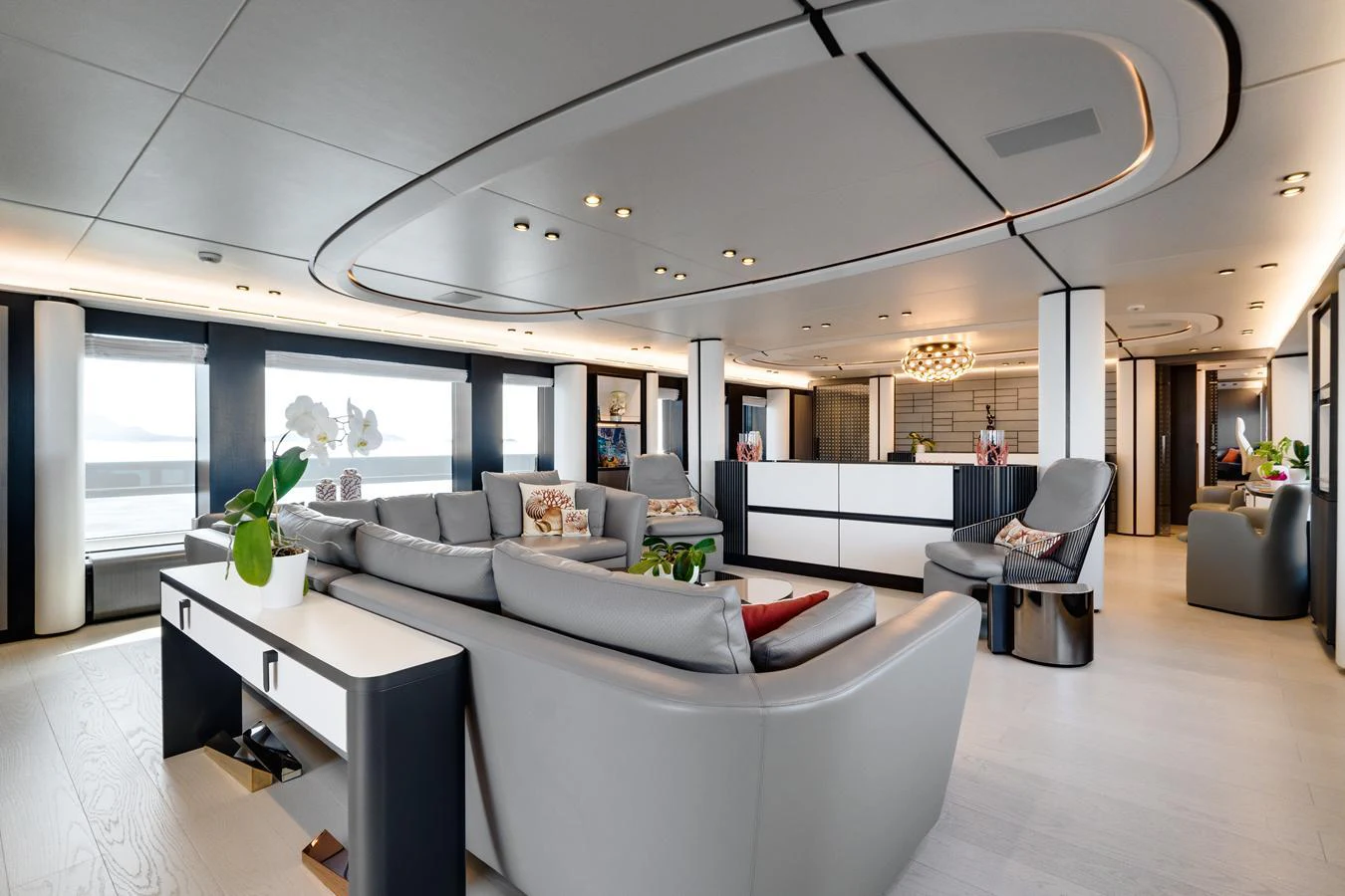 The spacious salon features modern furnishings and ample seating for relaxation. aboard L.A.U.L. Yacht for Sale