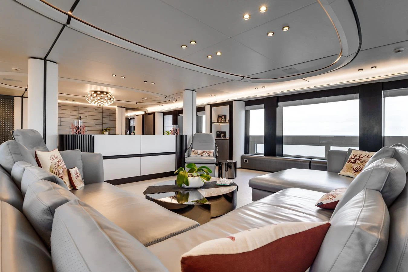 The yacht's salon features a spacious and modern seating area with large windows offering panoramic views. aboard L.A.U.L. Yacht for Sale