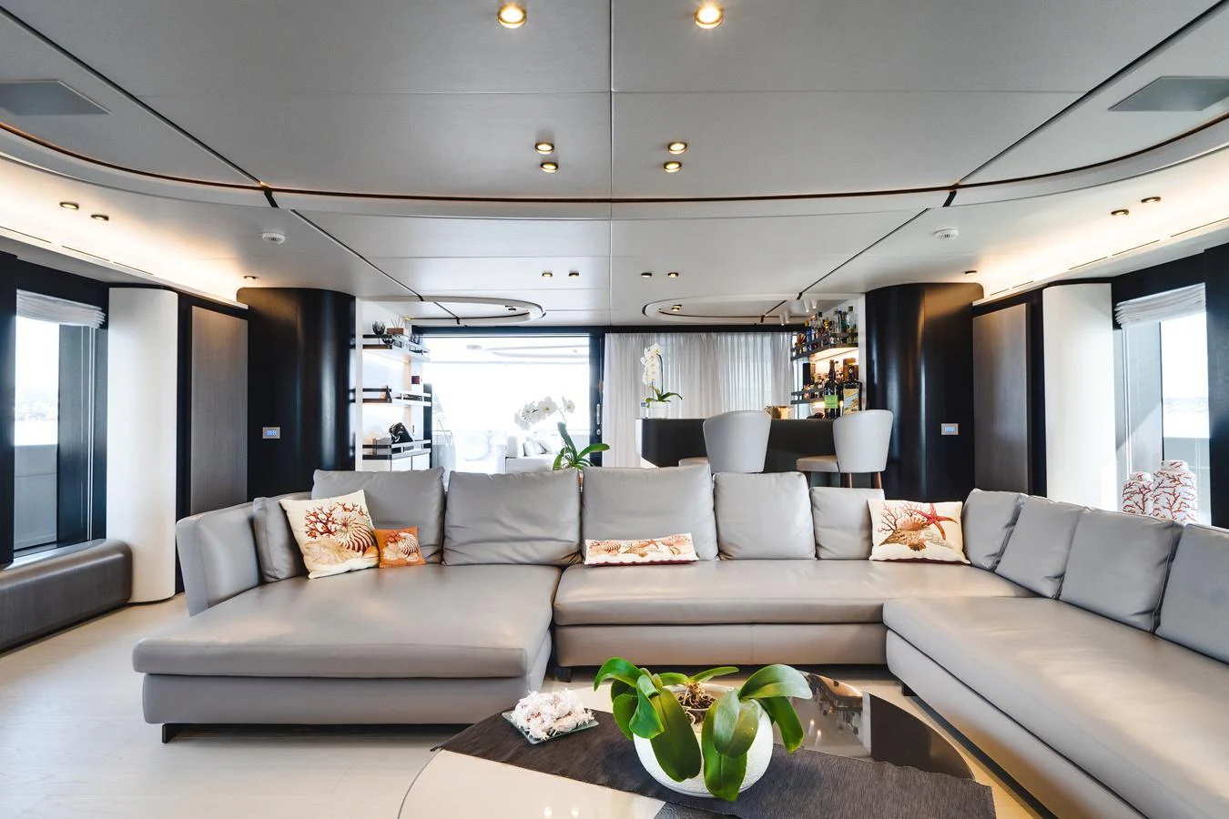 The yacht's interior features a spacious and modern lounge area with ample seating and elegant decor. aboard L.A.U.L. Yacht for Sale