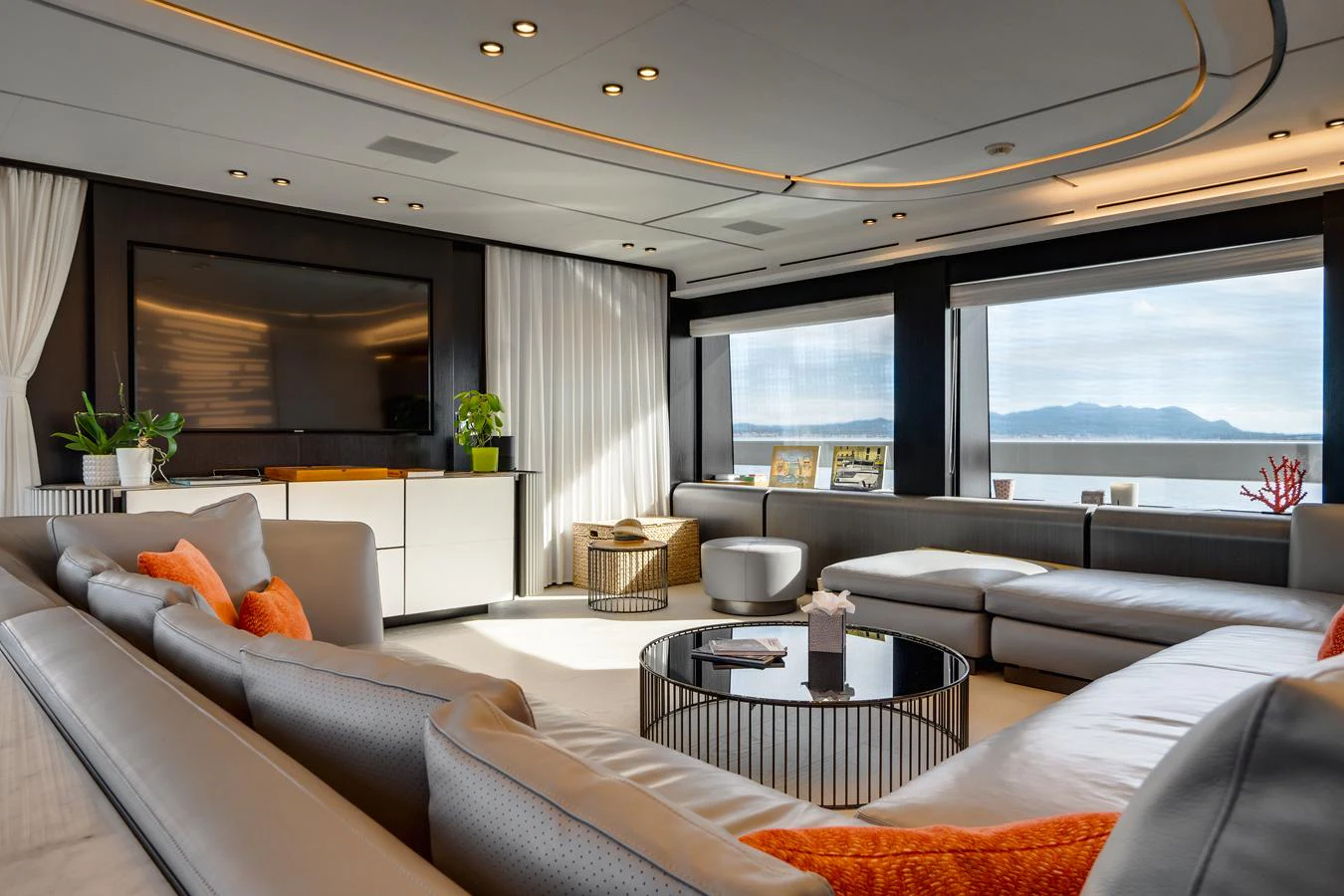 The salon features luxurious seating with panoramic views and modern decor. aboard L.A.U.L. Yacht for Sale