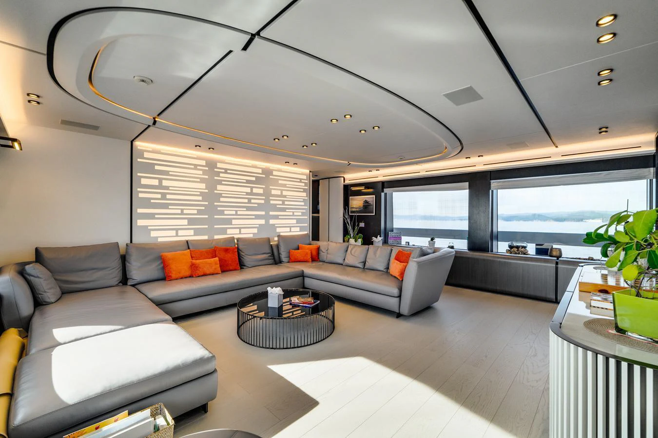 The salon features a spacious and modern seating area with ample natural light. aboard L.A.U.L. Yacht for Sale