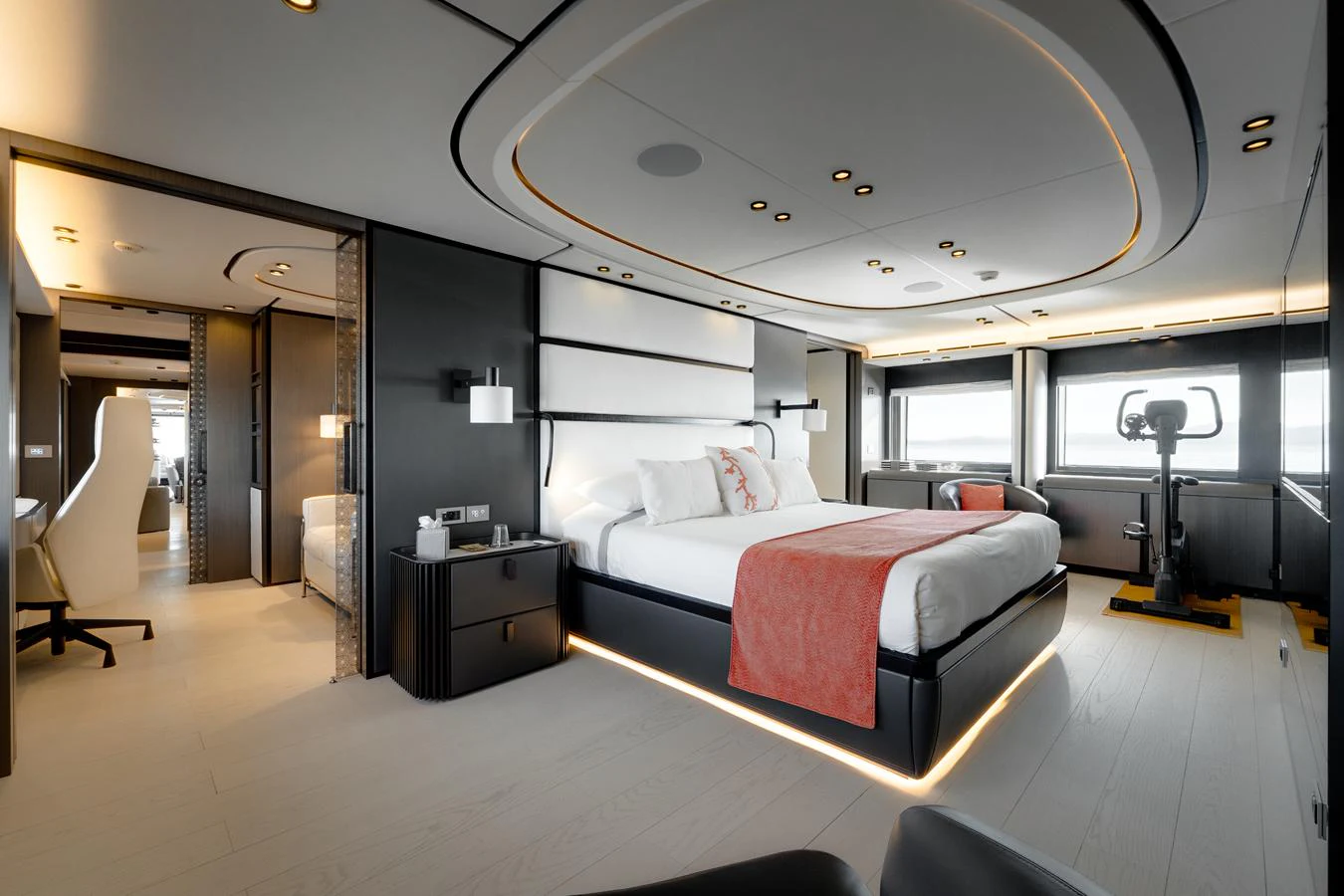 The master stateroom features a luxurious bed, modern decor, and ample natural light. aboard L.A.U.L. Yacht for Sale