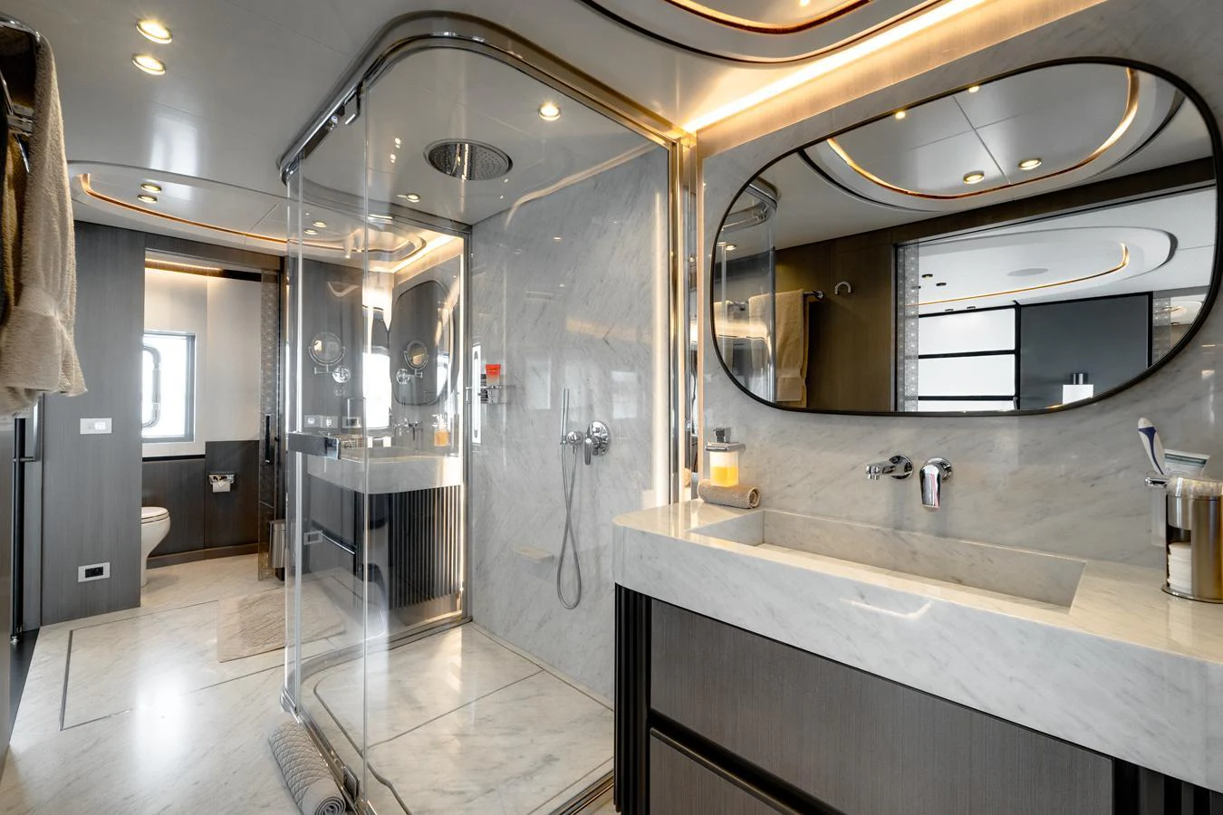 The yacht's bathroom features modern fixtures and a spacious shower area with elegant lighting. aboard L.A.U.L. Yacht for Sale
