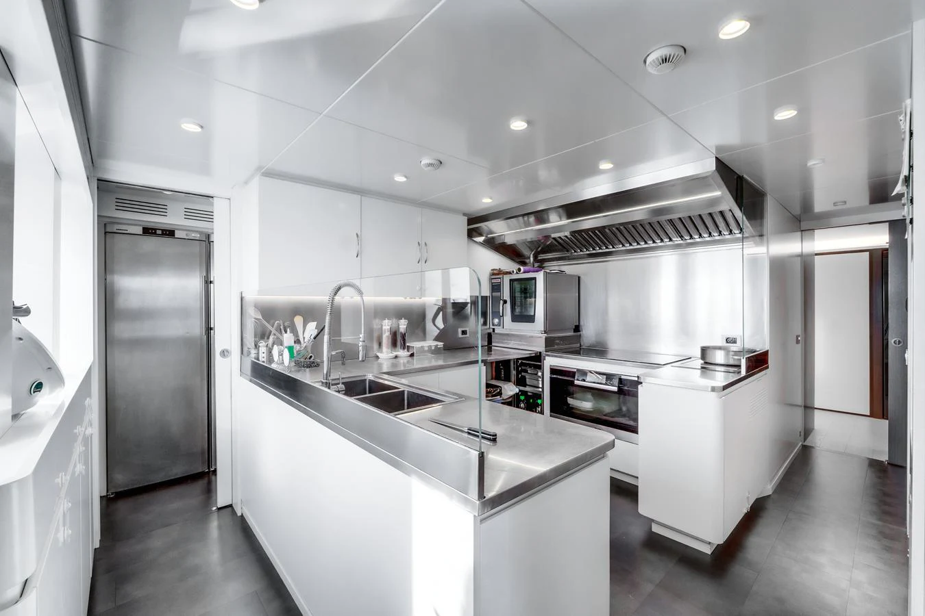 The yacht's galley is equipped with modern appliances and ample counter space, ideal for gourmet cooking. aboard L.A.U.L. Yacht for Sale