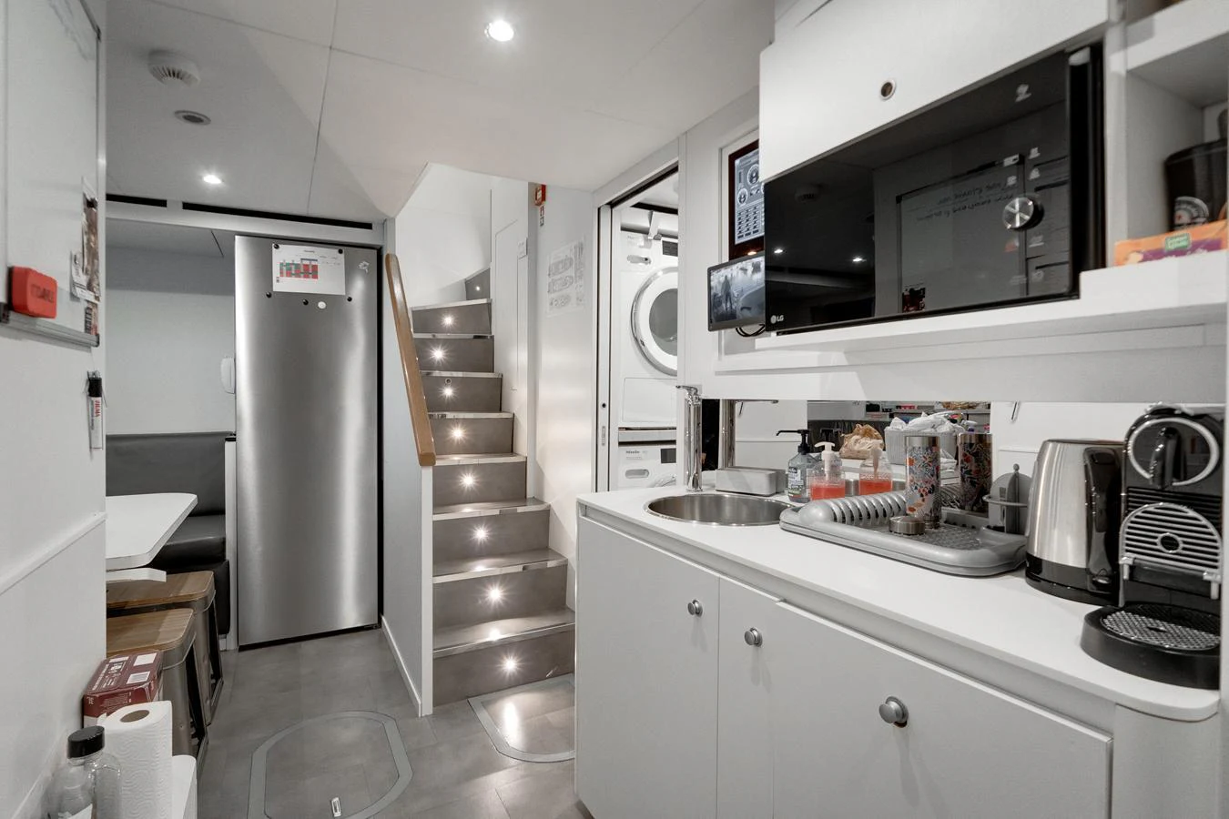 The yacht's galley features modern appliances and a sleek, functional design. aboard L.A.U.L. Yacht for Sale