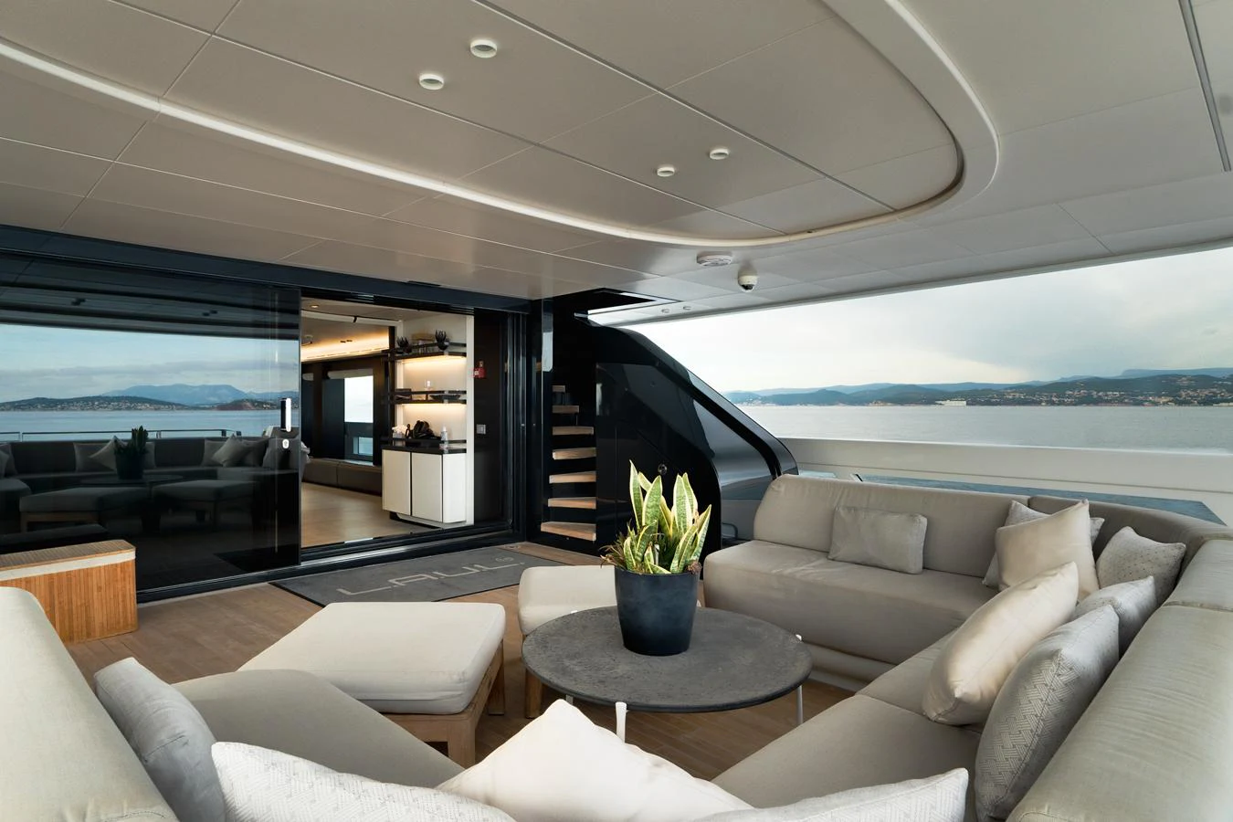 The spacious salon offers a luxurious seating area with panoramic views of the sea. aboard L.A.U.L. Yacht for Sale