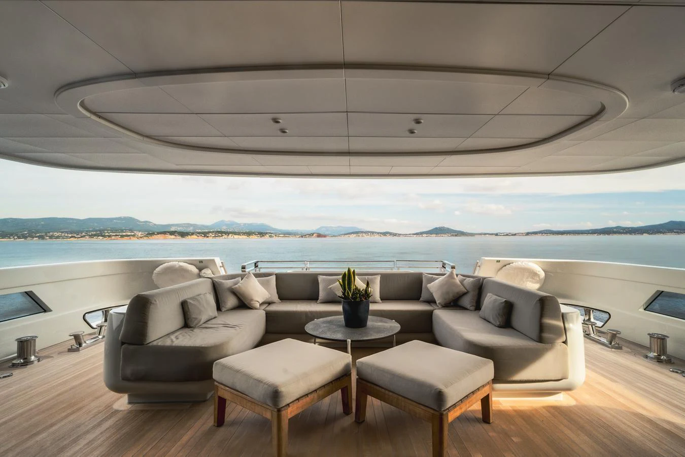 The aft deck features a luxurious seating area with panoramic views of the sea. aboard L.A.U.L. Yacht for Sale